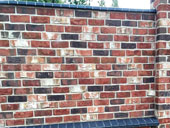 Забор из кирпича ручной формовки